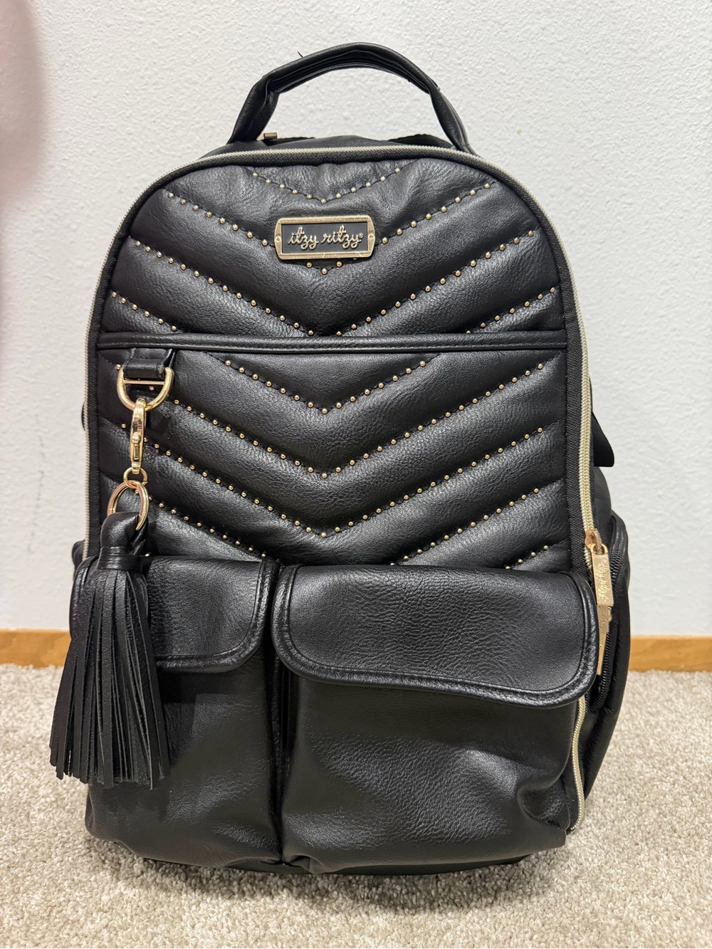 Itzy Ritzy Black Quilted Chevron Backpack with Tassel
